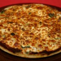 Sweet Sunshine Pizza · Big Tomato sauce, fresh garlic, spinach, sun-dried tomatoes, mozzarella, parmesan & goat che...