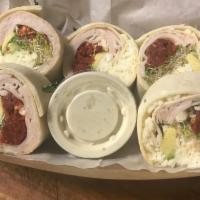 Original Wrap · Turkey, avocado, sun-dried tomatoes, alfalfa sprouts & mozzarella cheese. Served with our Mu...