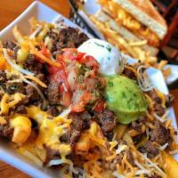 Carne Asada Fries · Asada, guacamole, sour cream, pico de gallo and cheese. 