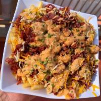 Pastrami Fries · Pastrami, cheese and island sauce.
