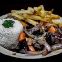 Crazy Lomo · Stir fried and marinated beef, red onions, tomatoes, cilantro, soy sauce, rice and choice of...
