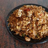 F1. House Fried Rice · Combination Fried rice with chicken, pork, shrimp, egg and green onion.