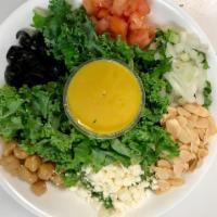 Kale Kale Salad · Deliciously tossed kale with chickpeas, tomato, onion, black olives, feta cheese with roaste...