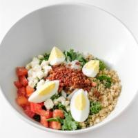 Quinoa Earthy Salad · Kale, hard-boiled egg, smoked bacon, quinoa, onion, tomato, goat cheese, with homemade crout...