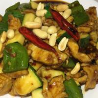 Kung Pao Chicken · Bell pepper, baby corn, zucchini in spicy kung pao sauce with peanuts on top. Spicy.