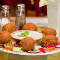 Falafel · A vegetarian delight of seasoned mixture of crushed garbanzo beans, parsley, garlic, onion a...