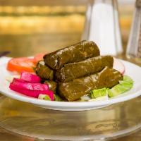 Dolma · Stuffed grape leaves. A seasoned mixture of rice, parsley, chopped onions and tomatoes rolle...