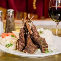 7. Lamb Chops · French cut lamb chops char-broiled to perfection and served with basmati rice and hummus. Se...