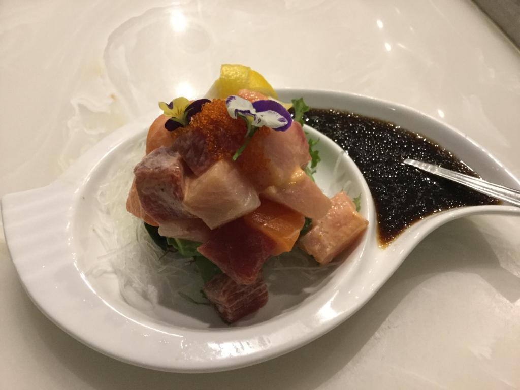 Trio dice bowl · Diced tuna ,salmon,yellowtail,tobiko and spicy mayo mixed with seaweed salad,bottom with half avocado.