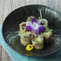 Duck Roll · Roast duck, cucumber, green vegetable, avocado and scallion wrapped with rice pancake.