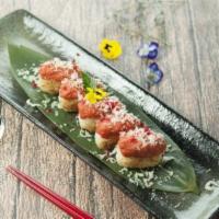 Crispy Rice Ball · Served with tobiko, spicy tuna on the top and spicy mayo eel sauce. 