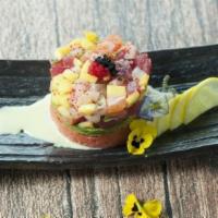 Sashimi Tartar · Spicy tuna, avocado and chop tuna, salmon and yellowtail.