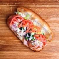 Turkey Breast Sub · Turkey, mayo, mozzarella, green peppers, onions, black olives, lettuce and tomatoes. Served ...