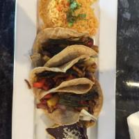 Tacos Poblano · Fire roasted corn, grilled veggies, sweet potato and poblano peppers. Vegetarian.