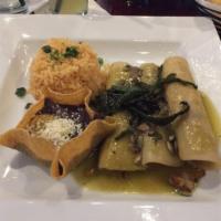 Veggie Enchiladas · 3 vegetable filled enchiladas covered in salsa verde and topped with avocado. Served with ri...