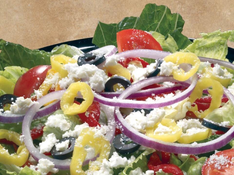 Mediterranean Salad · Inspired by the Italian coast, we toss fresh greens with red onions, roasted red peppers, black olives, tomatoes and banana peppers. Finished with feta and Pecorino Romano cheese. 