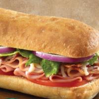 Club Sub · Turkey, ham, crisp bacon and mozzarella cheese topped with red onions, lettuce, tomatoes and...