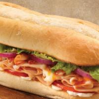 Turkey Bacon Cheddar Sub · Turkey and crisp bacon combined with mozzarella and cheddar cheeses. Finished with red onion...