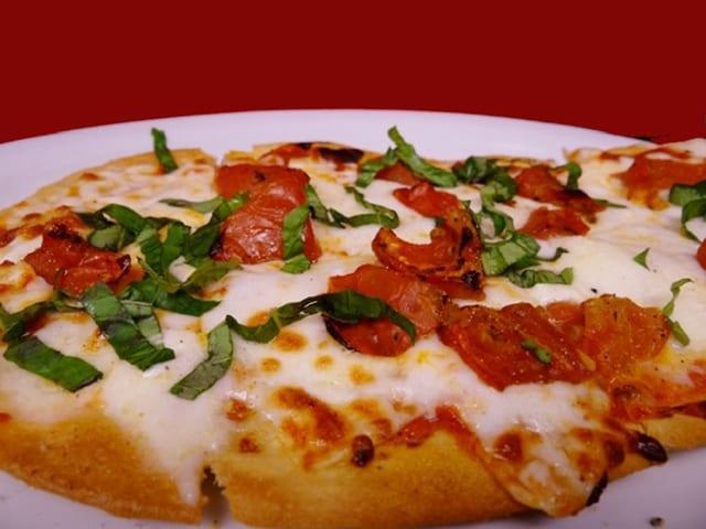 Margherita Flatbread Pizza · Fresh Mozzarella, Italian basil, oven roasted tomato, Homemade Marinara Sauce