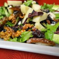 Mediterranean Salad · Greens, feta, cucumbers, olives, walnuts, dates, lemon and olive oil dressing