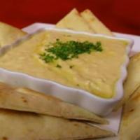 Homemade Hummus · Cream of chick peas, garlic, lemon and olive oil. 
