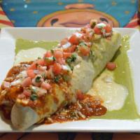 Macho Burrito · Filled with chicken tamal, carnitas, shredded chicken, ground beef, rice, black and refried ...