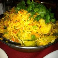 11. Vegetable Biryani · Mixed veggie and home made cheese cooked in Himalayan herbs and spices with Basmati rice. Se...