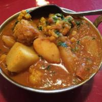 20. Aloo Gobi · Potatoes and cauliflower cooked with onion and tomato sauce with Himalayan herbs and spices....