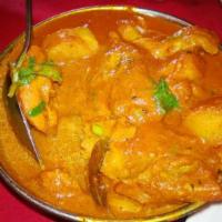39. Chicken Vindaloo · Boneless chicken, potato, onion and tomato gravy cooked in Himalayan herbs and spices, vineg...