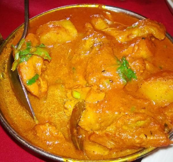 39. Chicken Vindaloo · Boneless chicken, potato, onion and tomato gravy cooked in Himalayan herbs and spices, vinegar and vindaloo sauce.