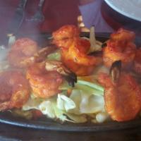 68. Shrimp Tandoori · Shrimp marinated in yogurt, Himalayan herbs and spices grilled in the tandoor oven and serve...