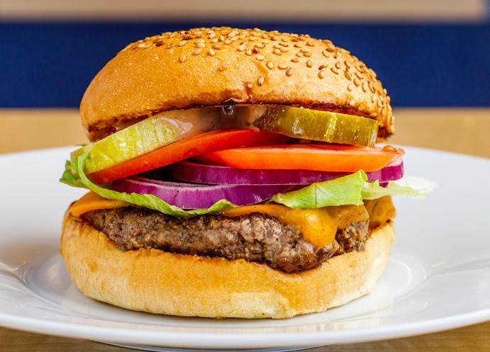 Cheeseburger · 1/3LB Hand-Made Lean USDA Beef, cheddar cheese, crisp lettuce, red ripe tomato slice, sliced red onions, hand-cut pickles and our Special Homemade sauce. Served on a toasted fresh baked sesame seed bun.