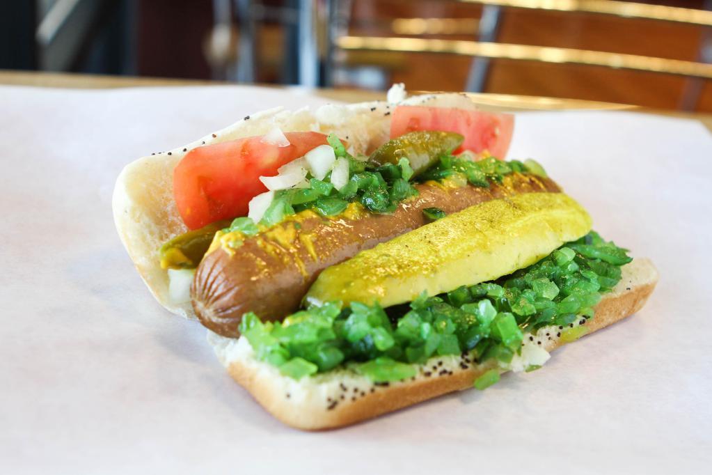 Chicago Style Hot Dog · Served with everything includes: mustard, relish, freshly chopped onions, red ripe tomato slices, kosher pickle and sport peppers with celery salt.