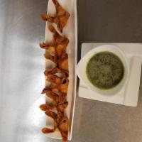 Crab Rangoon Wontons · Deep fried dumpling stuffed with crab meat, onion and celery. Served with house green sauce.