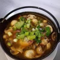 Tom Yum Chicken Soup · Spicy and sour with mushrooms, lemon grass, alanga, kaffir lime leaf and cilantro.