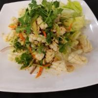 Squid Salad · Grilled squid, sriracha sauce, lemon grass and onions.