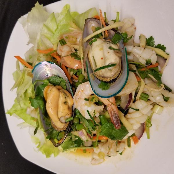 Seafood Salad · Mussel, prawns, squid, scallops, lemon grass, onion and mint.