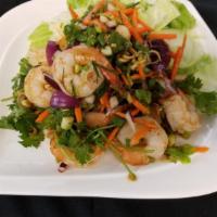 Pla Goong Salad · Grilled prawn, lemon grass, sweet chili paste, onions, mint and lime juice.