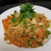 Crab Fried Rice · Fried rice with crabs meat, egg, peas, carrots yellow and green onions.