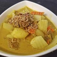 Lamb Curry · Yellow curry with potato, carrots and onions.