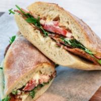Amici's BLT Sandwich · Applewood smoked bacon, wild baby arugula and sliced Roma tomatoes.