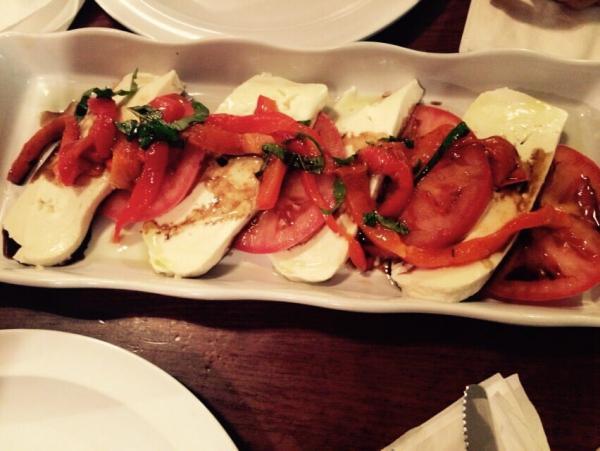 Caprese · Sliced beefsteak tomatoes, fresh mozzarella and roasted red peppers drizzled with extra virgin olive oil and balsamic vinegar.
