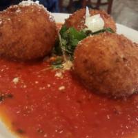 Arancini · 3 pieces. Rice balls with risotto cheese and peas served with our homemade marinara sauce.