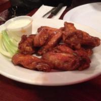 Buffalo Wings · Cooked wing of a chicken coated in sauce or seasoning. Choice of bleu cheese or ranch dressi...