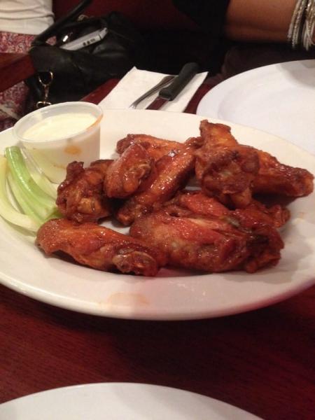 Buffalo Wings · Cooked wing of a chicken coated in sauce or seasoning. Choice of bleu cheese or ranch dressing. Extra dressing for an additional charge.