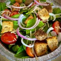 Spinach Salad · A large spinach salad with tomatoes, red onion, shredded parmesan and croutons.