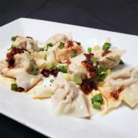 Canton Spicy Wonton · 8 pieces. Steamed wontons with chicken fillings, served with spicy garlic sauce.