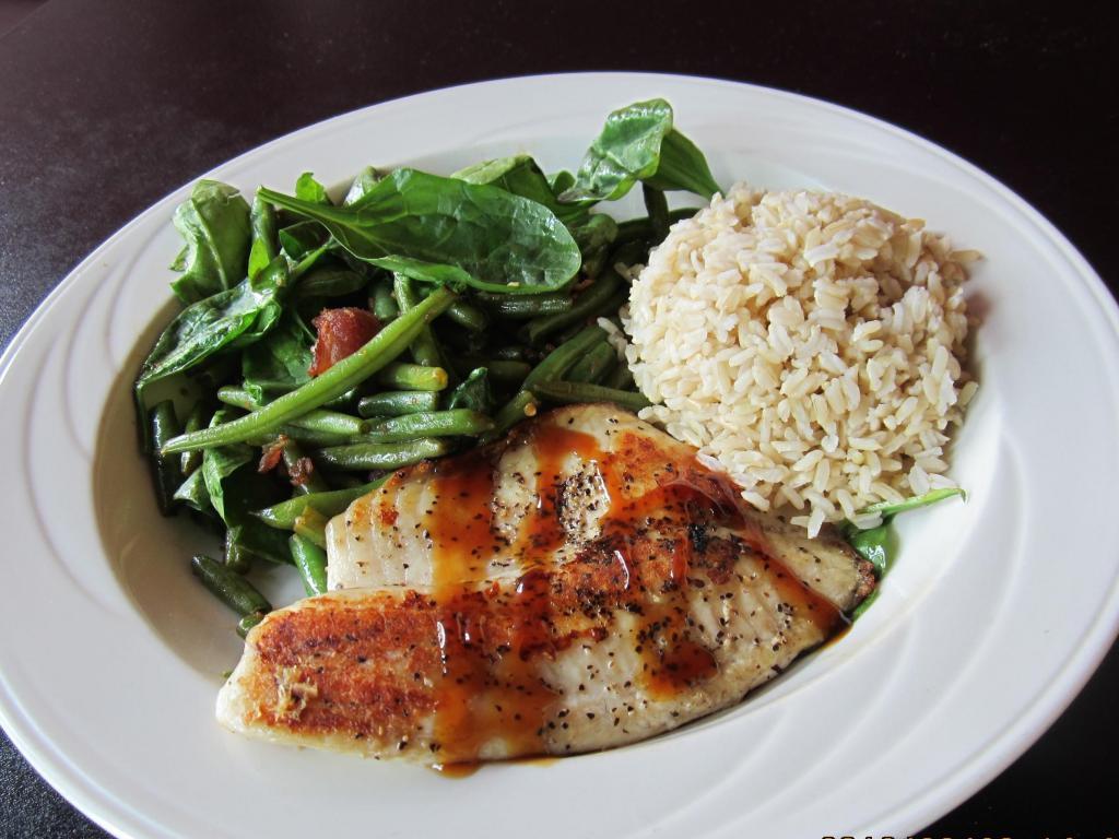 Chef's Special Grilled Cajun Fish · Cajun seasoning fish fillet. Serves with spinach, tossed green beans with bacon and choice of rice.