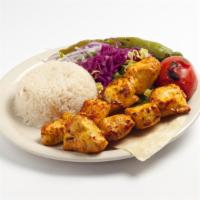 Chicken Shish Kebab · Chunks of chicken breast marinated in homemade sauce and char-grilled on skewers. Served wit...