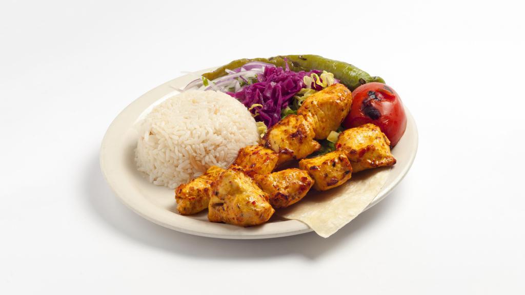 Chicken Shish Kebab · Chunks of chicken breast marinated in homemade sauce and char-grilled on skewers. Served with rice and vegetables.